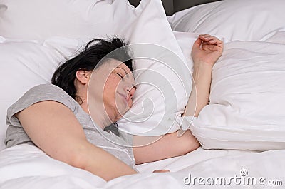 Young woman enjoying a good restful sleep Stock Photo