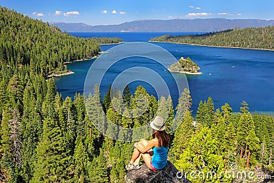 Young woman enjoying the view of Emerald Bay at Lake Tahoe, Cali Stock Photo