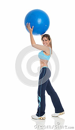 Young woman exercising with a pilates ball Stock Photo