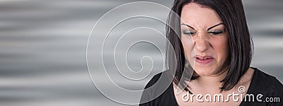 Young woman with an expression of disgust Stock Photo