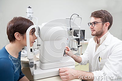 Young woman during an eye exam with the ophthalmologist Stock Photo