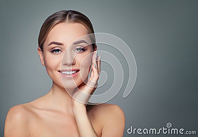 Young woman face. Healthy skin, cute smile. Perfect girl smiling. Facial treatment, skincare and cosmetology concept Stock Photo