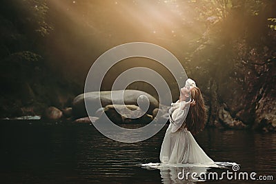 Young woman in fairy pond Stock Photo