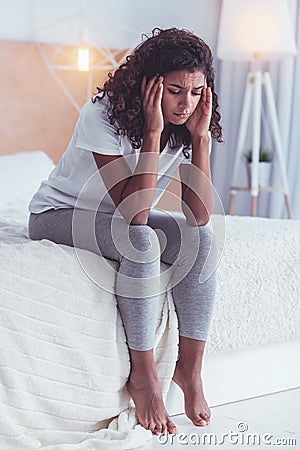 Young woman feeling awful after breakup with boyfriend Stock Photo