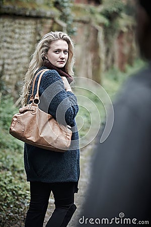 Young Woman Feeling Threatened As She Walks Home Stock Photo