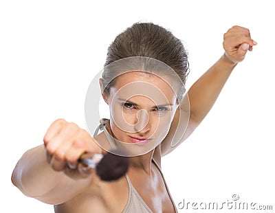 Young woman fencing with brush Stock Photo
