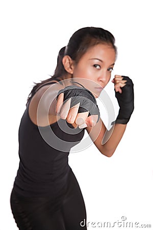 Young woman fitness trainer in combat pose Stock Photo