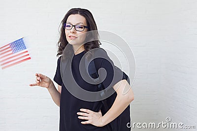 Young woman with the flag of the United States of America. Stock Photo