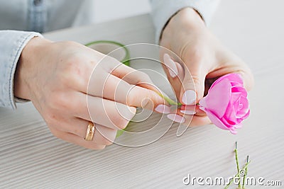 Florist does a wreath with artificial flowers from Foamiran Stock Photo