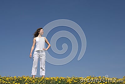 Young woman in flowering field Stock Photo