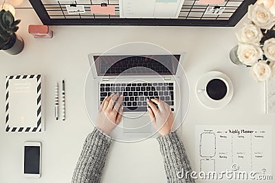 Young woman freelancer indoors home office concept winter atmosphere workplace top view Stock Photo