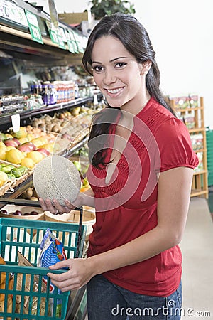 Young Woman Fruit Shopping In Supermarket Stock Photo
