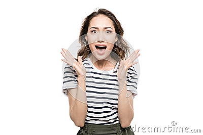 Young woman gesturing open hands and looking at camera Stock Photo