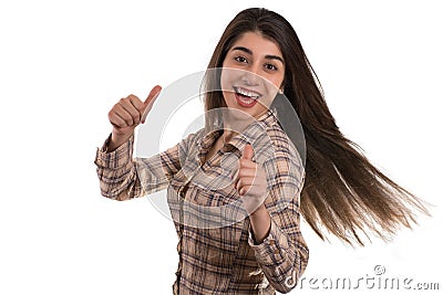 Young woman gesturing thumbs up Stock Photo