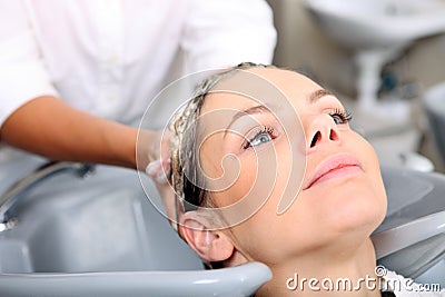 Young woman gets a hairdo in the beauty- Stock Photo