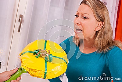 Young woman gets an loveless gift Stock Photo