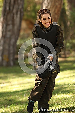 Young woman getting ready for paintball Stock Photo