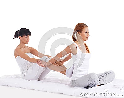 A young woman getting a traditional Thai massage Stock Photo