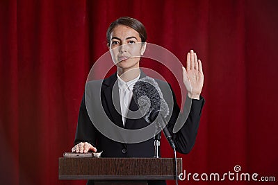 Young Woman Giving Oath on Stage Stock Photo