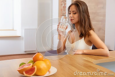 Young Woman with glass of Water. Healthy Lifestyle Stock Photo