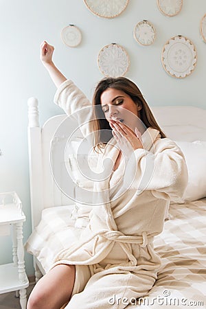 Young woman going to bed - getting out of the bed Stock Photo