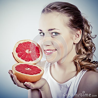 Young woman with grapefruit Stock Photo