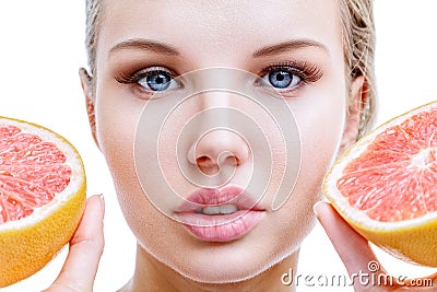 Young woman with grapefruit in hands Stock Photo