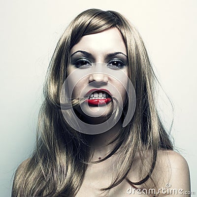 Young woman with hair in a mouth Stock Photo