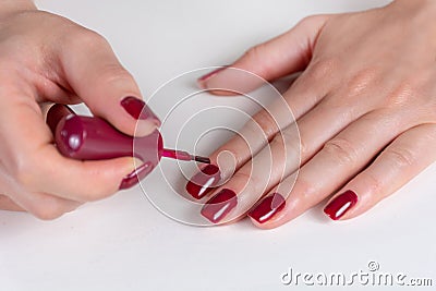 Effortless Elegance: Artful Nails Painted in Dark Red Polish Stock Photo