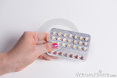 Young woman hand holding a contraceptive pills blister Stock Photo