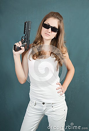 Young woman handgun Stock Photo