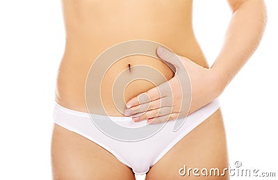 Young woman with hands on belly-stomach ache Stock Photo