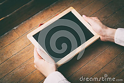 Young woman hands holding little board Stock Photo