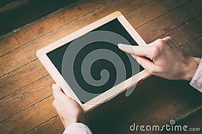 Young woman hands holding little board Stock Photo