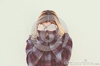 Young woman with hands over face in retro style portrait Stock Photo