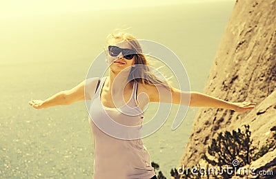 Young Woman happy smiling hands raised Stock Photo