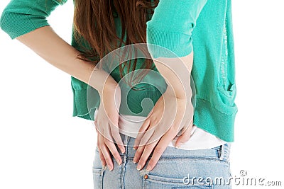Young woman is having back pain. Stock Photo