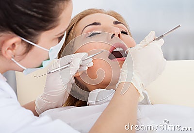 Young woman having dental checkup Stock Photo