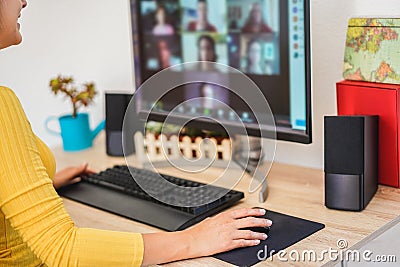 Young woman having a discussion meeting in video call with her team - Girl having chatting with friends on computer web app - Stock Photo