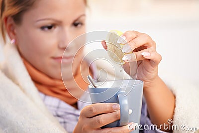 Young woman having flu drinking tea feeling bad Stock Photo