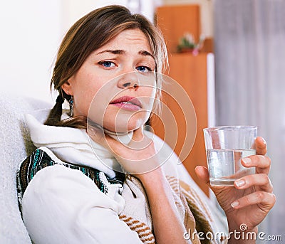 Young woman having heavy tonsillitis Stock Photo
