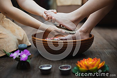 Young woman having her feet scrubbed in beauty salon, Female feet at spa pedicure procedure, Spa foot massage, Massage of woman`s Stock Photo