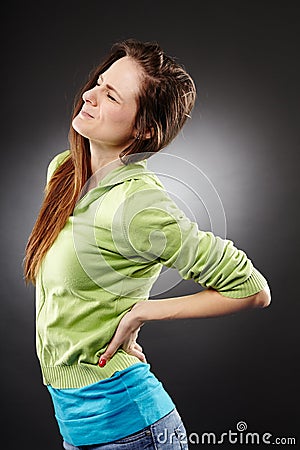 Young woman having a severe lumbar pain Stock Photo