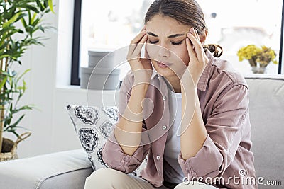 Young woman with headache Stock Photo