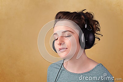 Young woman with headphones listening to music with copy space Stock Photo