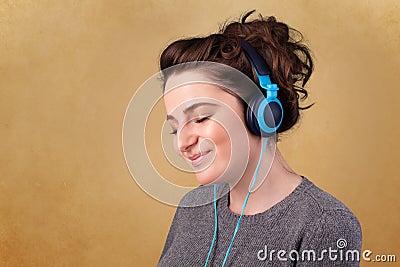 Young woman with headphones listening to music with copy space Stock Photo