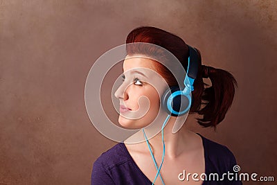Young woman with headphones listening to music with copy space Stock Photo
