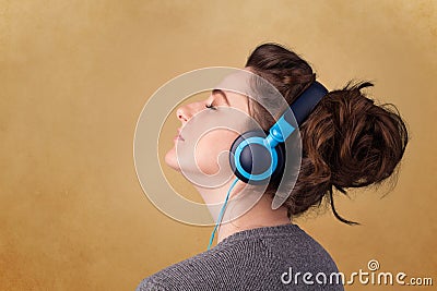 Young woman with headphones listening to music with copy space Stock Photo