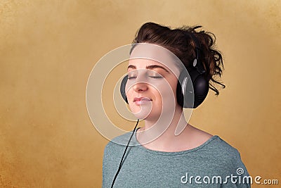 Young woman with headphones listening to music with copy space Stock Photo