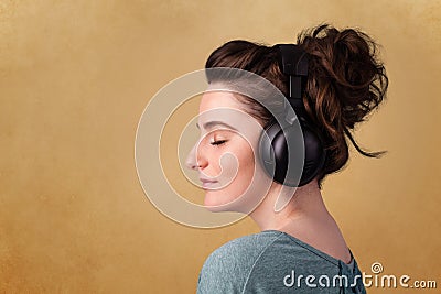 Young woman with headphones listening to music with copy space Stock Photo